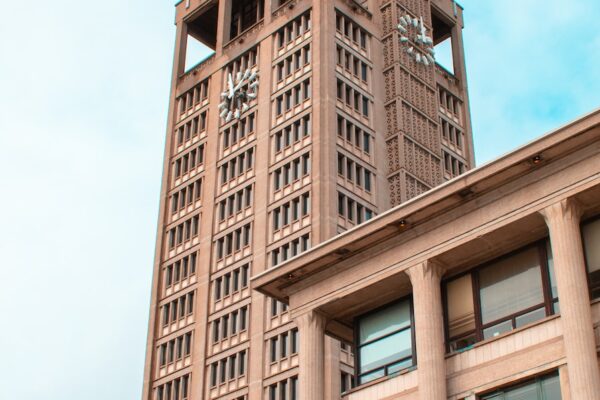 brown concrete building under blue sky during daytime