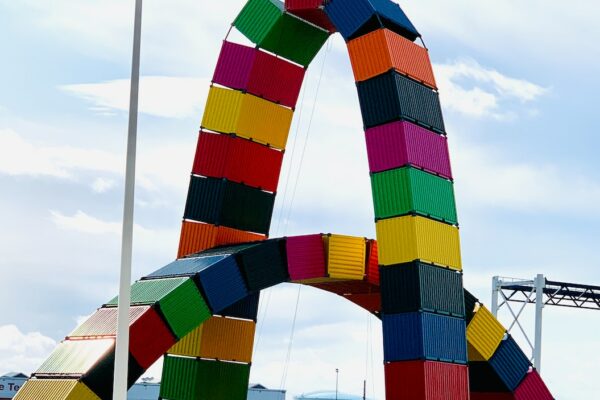 multicolored containers arch during daytime