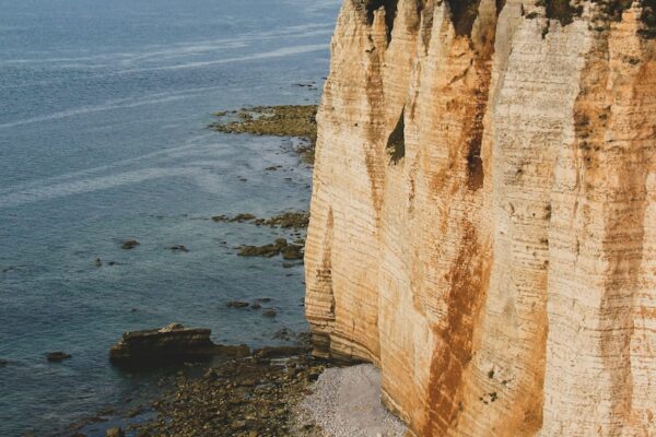 brown rock formation on sea shore during daytime