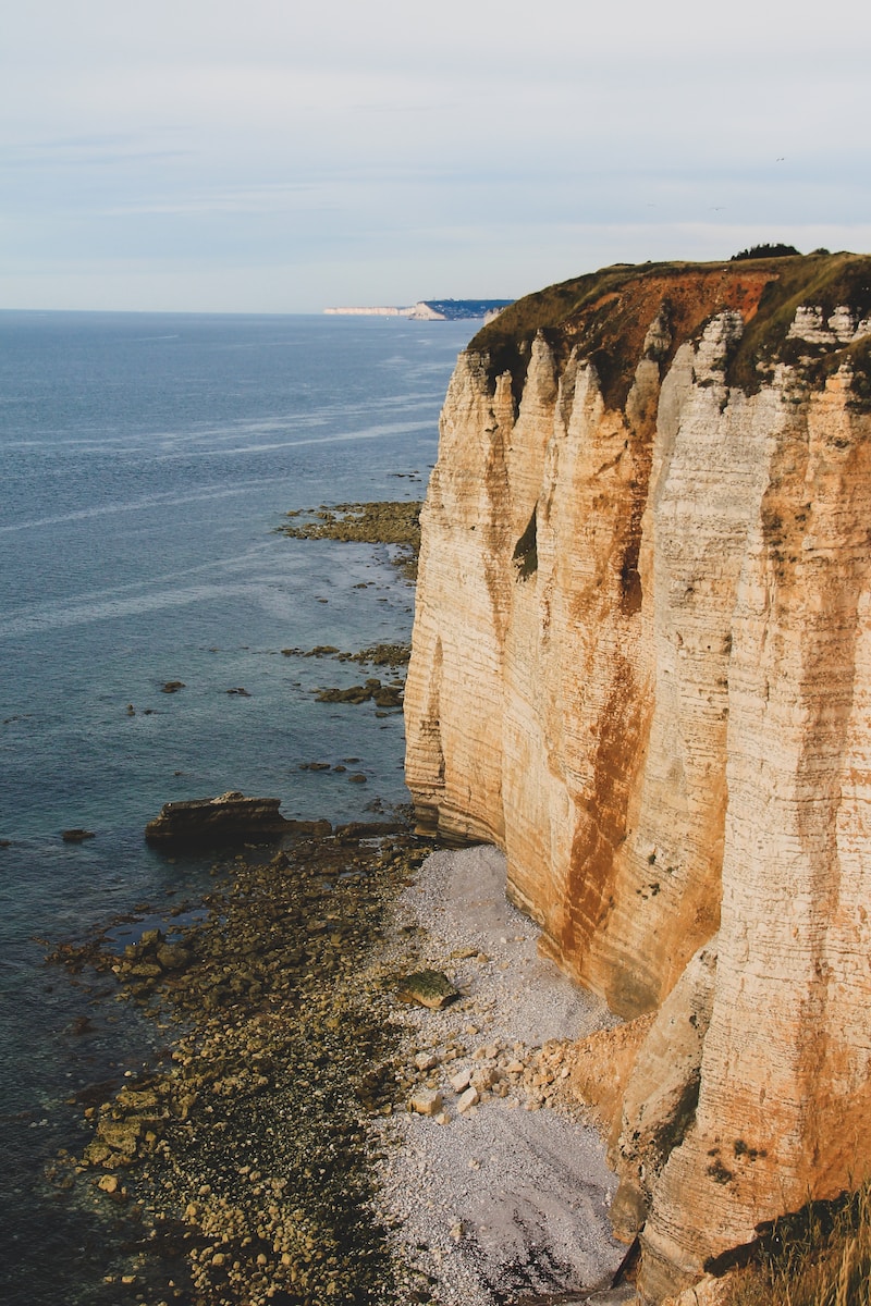 brown rock formation on sea shore during daytime